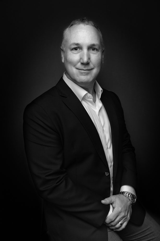 A team of executives captured in a corporate photoshoot in Singapore.