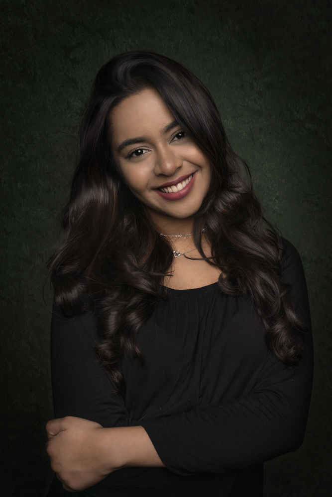 Professional young woman with a confident smile in corporate portrait by Magicdow