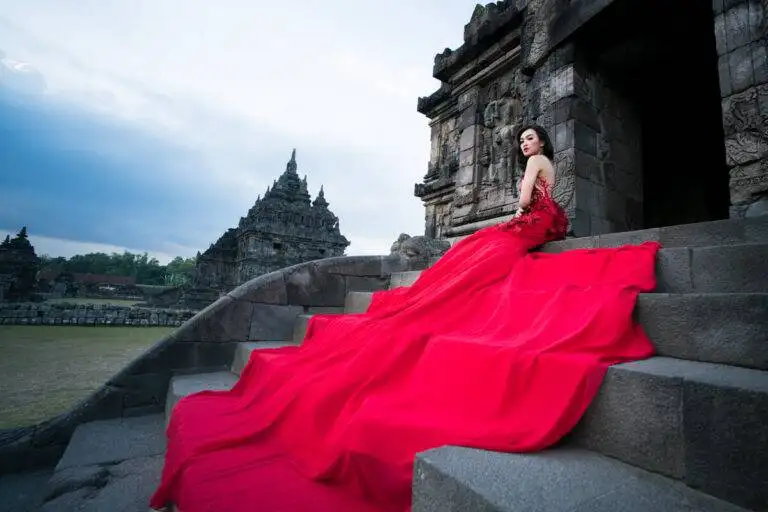 A beautiful bride posing in a traditional white wedding dress at an ancient temple in Yogyakarta, Indonesia. A beautiful bride posing in a traditional white wedding dress at an ancient temple in Yogyakarta, Indonesia.