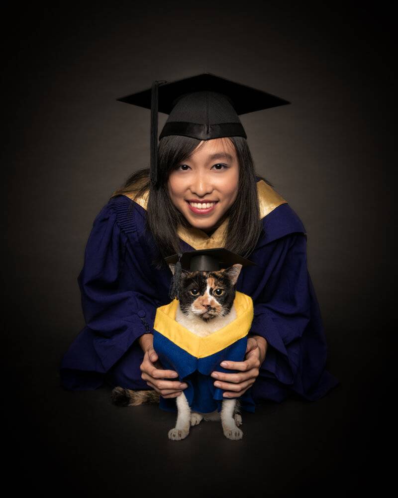 girl and cat graduate